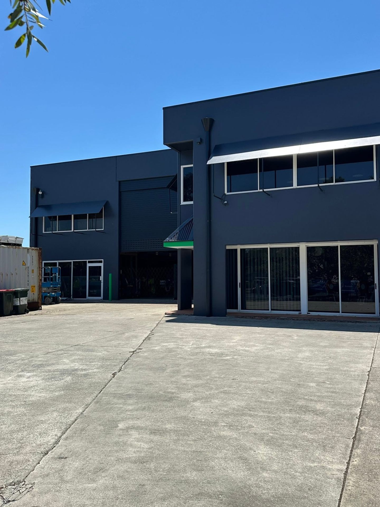 Commercial warehouse with a freshly coated charcoal roof
